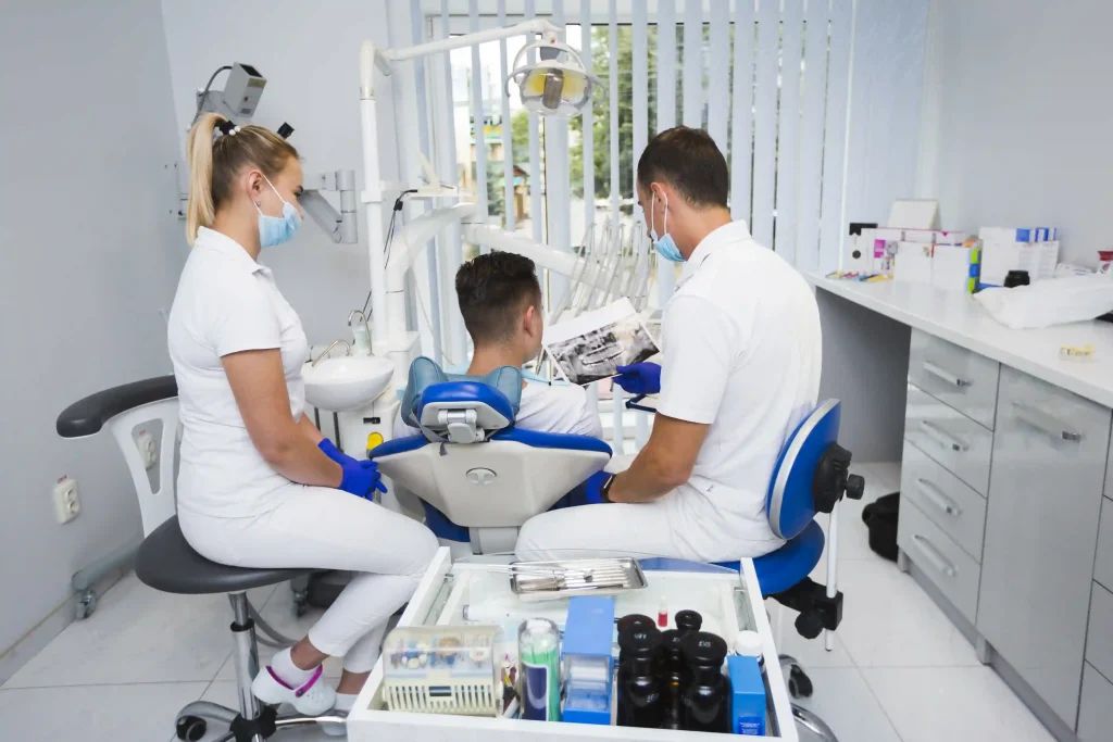 image of dentists and patient at Liberty Dentists London discussing the night guard from dentist